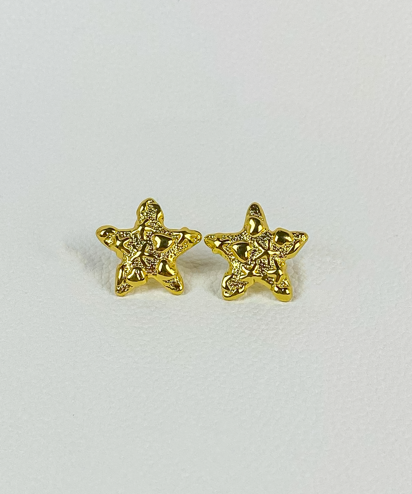 Gold star earrings