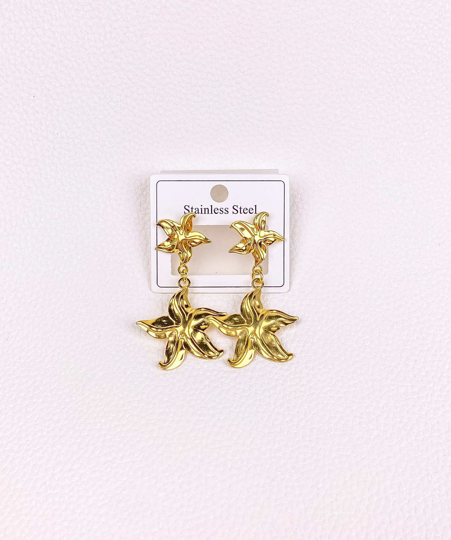 Star gold earrings